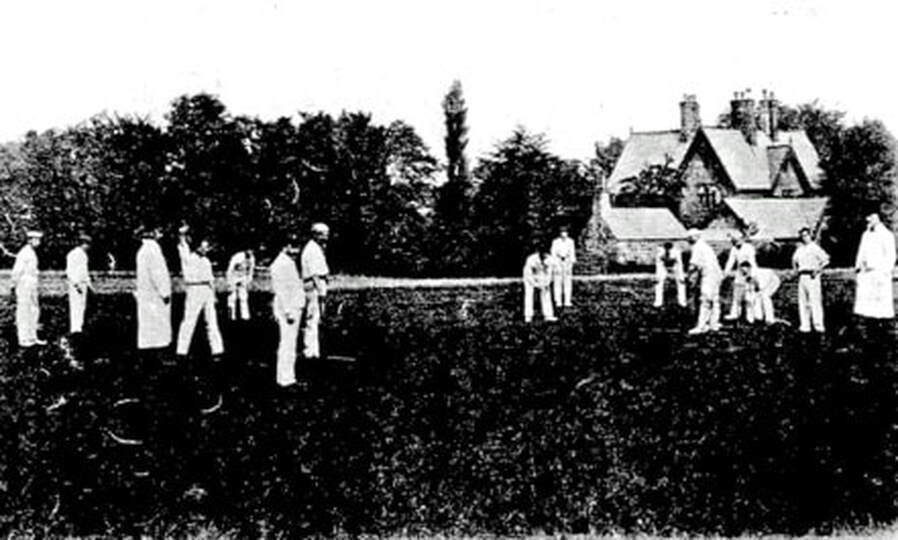 Pre-1900 - Burley v Ilkley at cricket. Burley in Wharfedale vicarage in background.