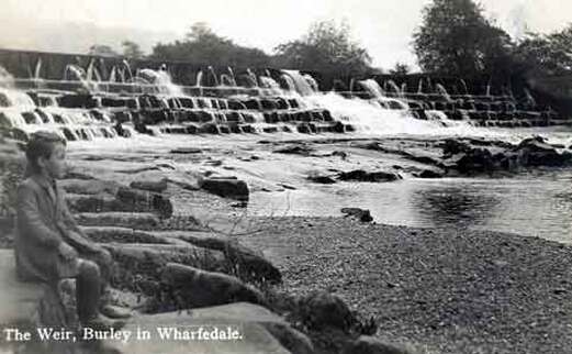 Weir boards raised at Greenholme, Burley in Wharfedale.