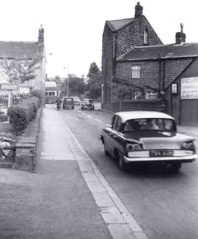 Police house (left) and Hall & Pickering (right), Main Street Burley in Wharfedale.