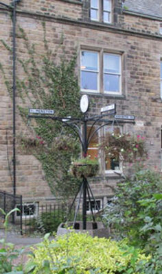 14 Askwith sign, Pudding Tree Garden, Main Street & Cornmill Lane, Burley in Wharfedale.