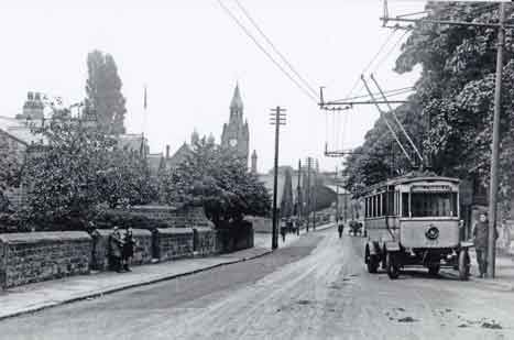 Trackless Tram with driver. Station Road & Main Street Junction, Burley in Wharfedale.